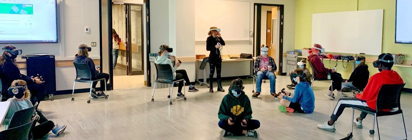 A group of people in a room

Description automatically generated